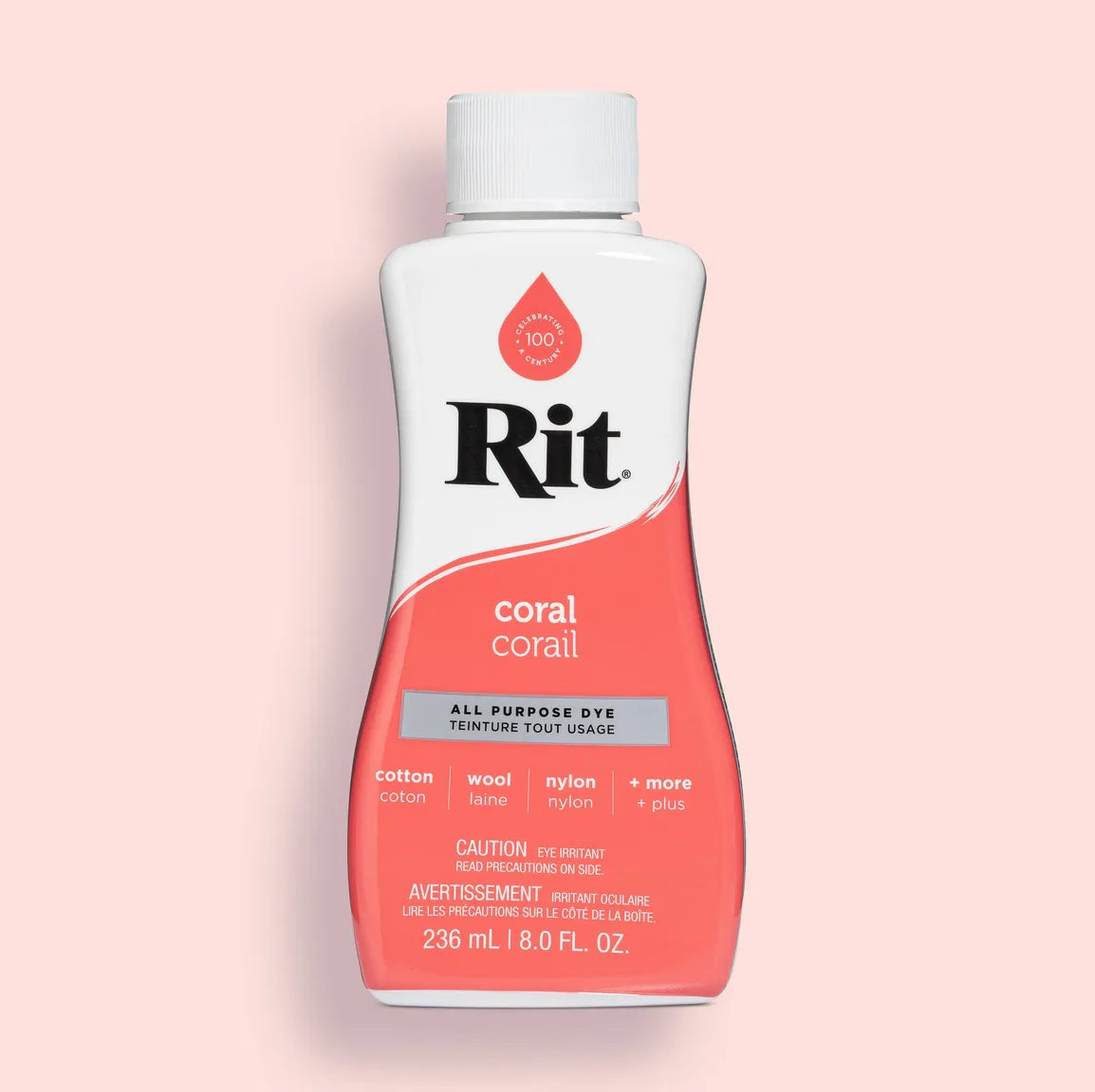 Rit all-purpose dye bottle in coral color on a pink background