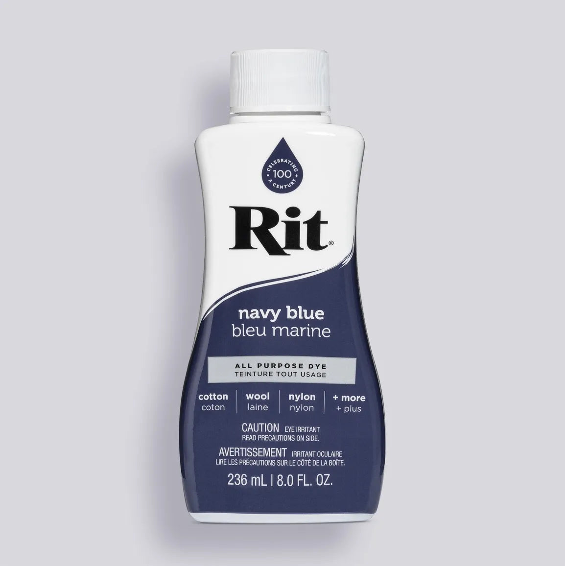 Bottle of Rit navy blue all-purpose dye on a gray background
