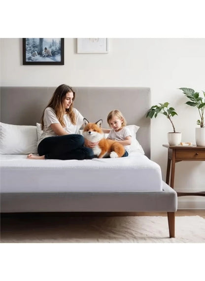 Mother, daughter and pet laying down on a terry cotton mattress protector
