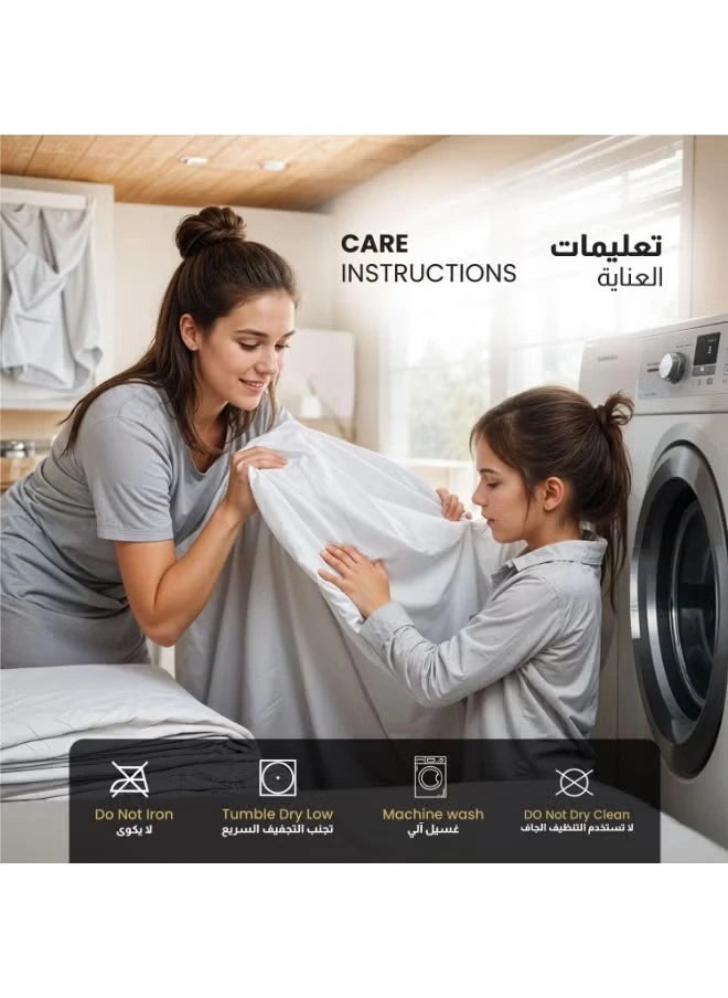 Mother and daughter putting terry cotton mattress protector in a washing machine