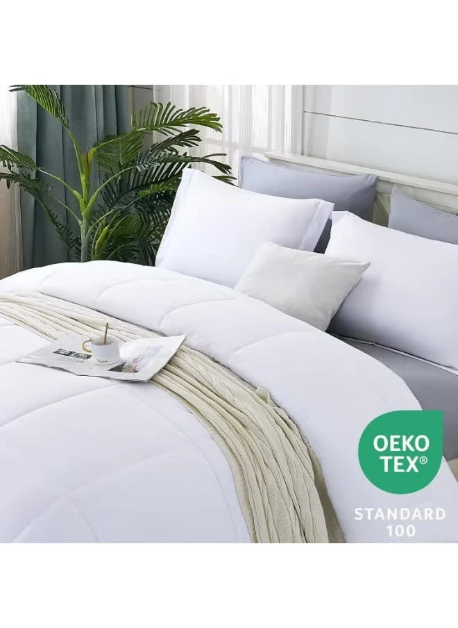 White bedding set on a bed with 'OEKO-TEX' certification label.
