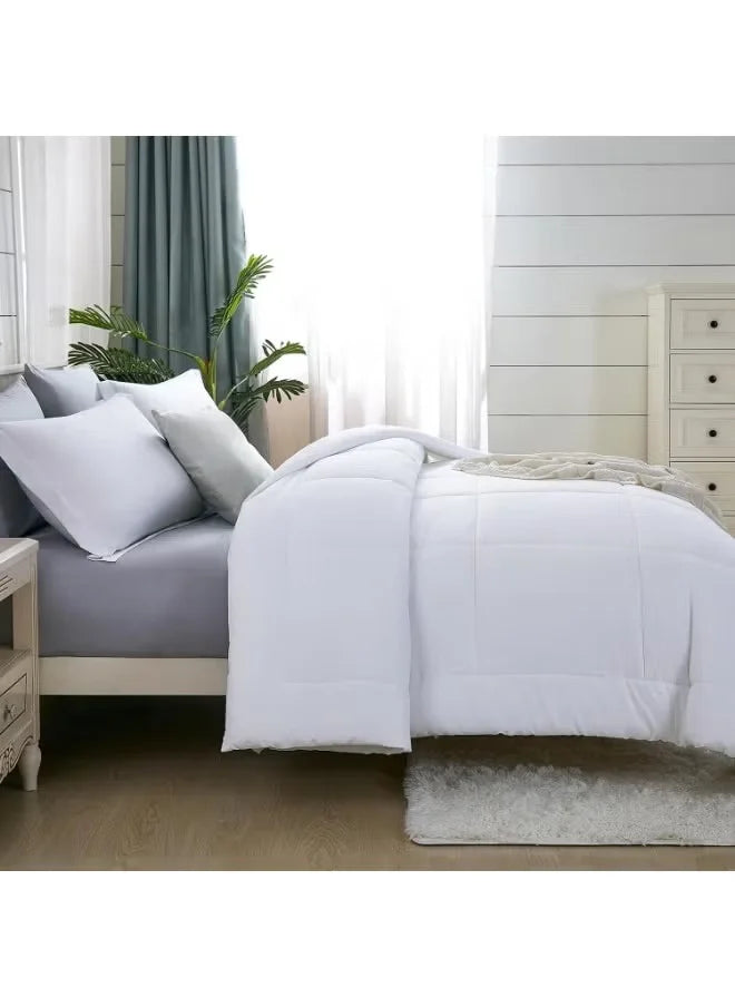 Bedroom with a bed featuring white bedding and white pillows, with a nightstand and plant in the background.