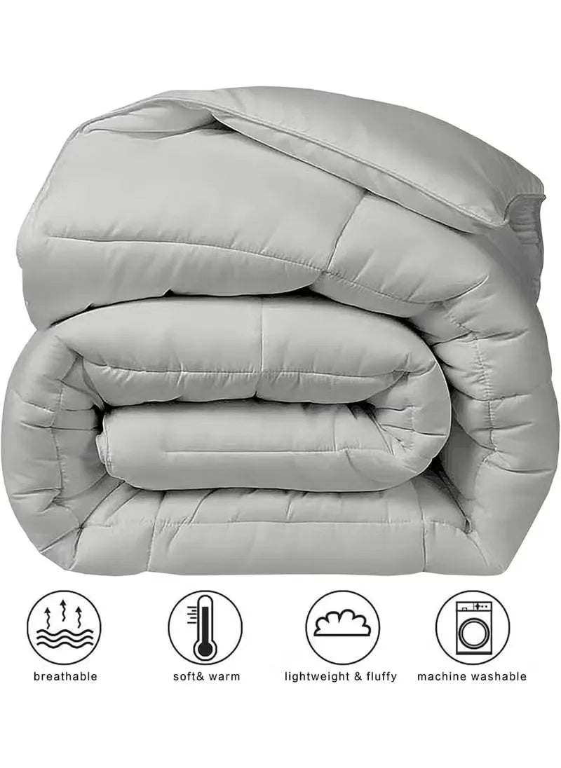 Folded gray comforter with features on a white background
