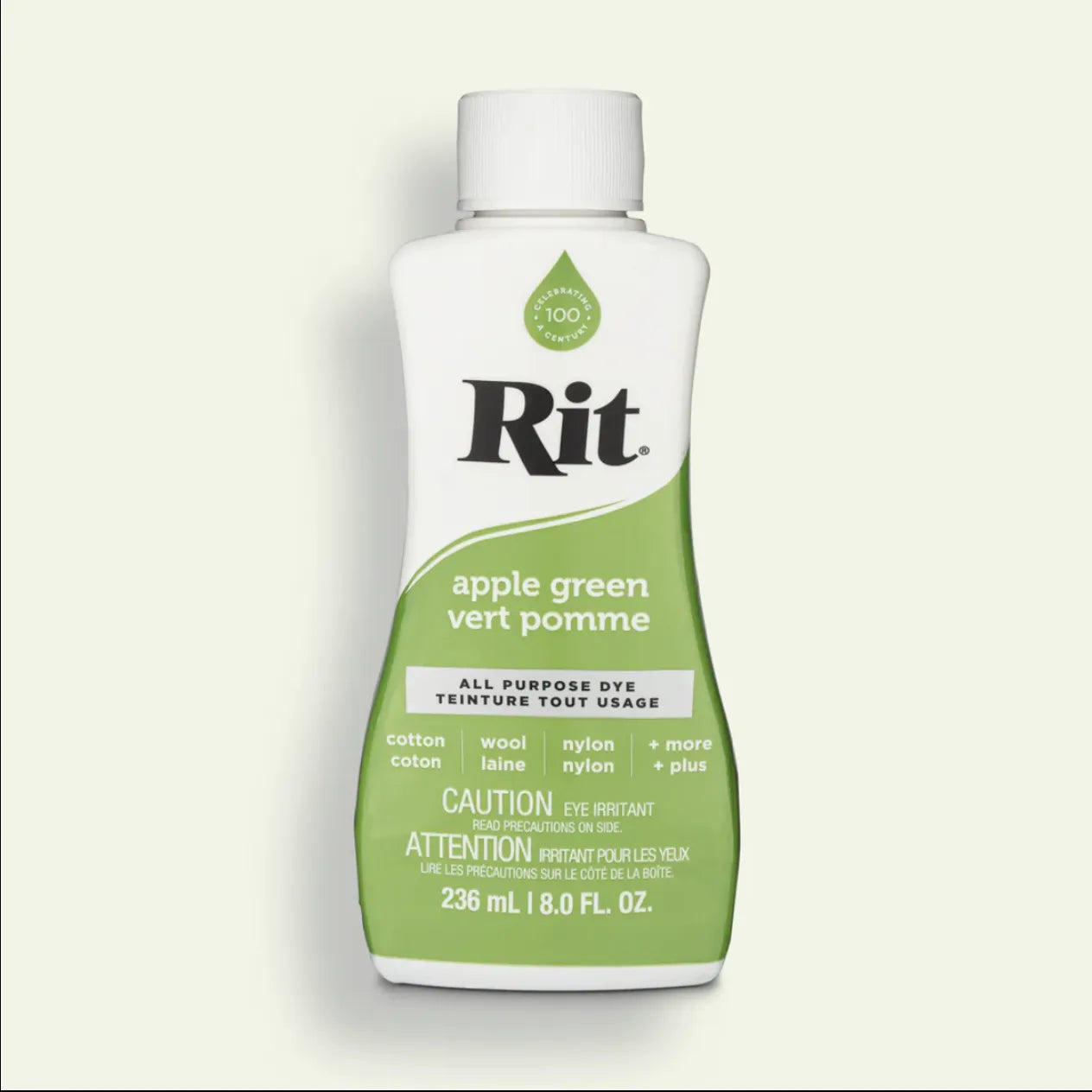 Rit all purpose dye bottle in apple green color on a light beige background