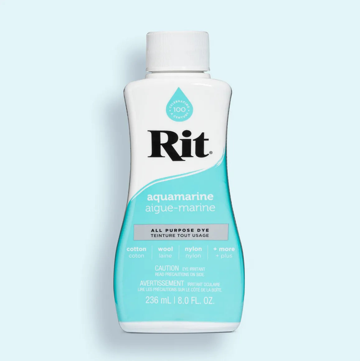 Rit all-purpose dye bottle in aquamarine color on a light blue background