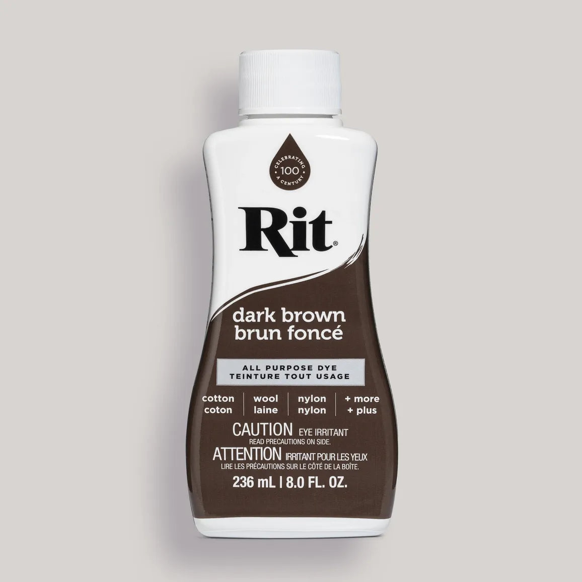 Bottle of Rit dark brown all-purpose dye on a gray background