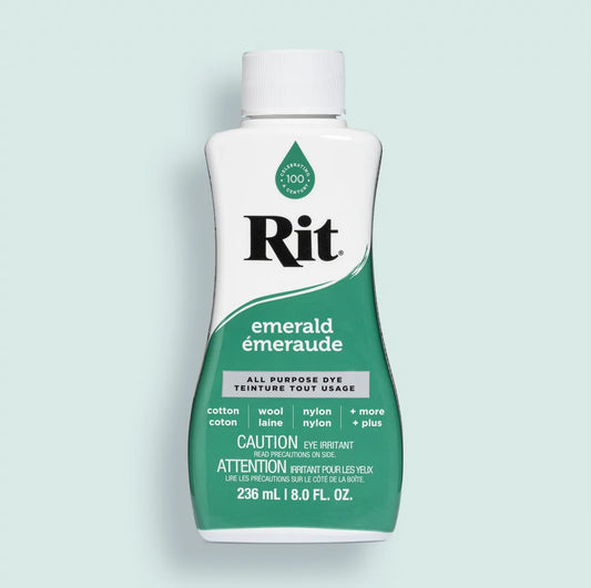 Bottle of Rit dye in emerald color on a light blue background