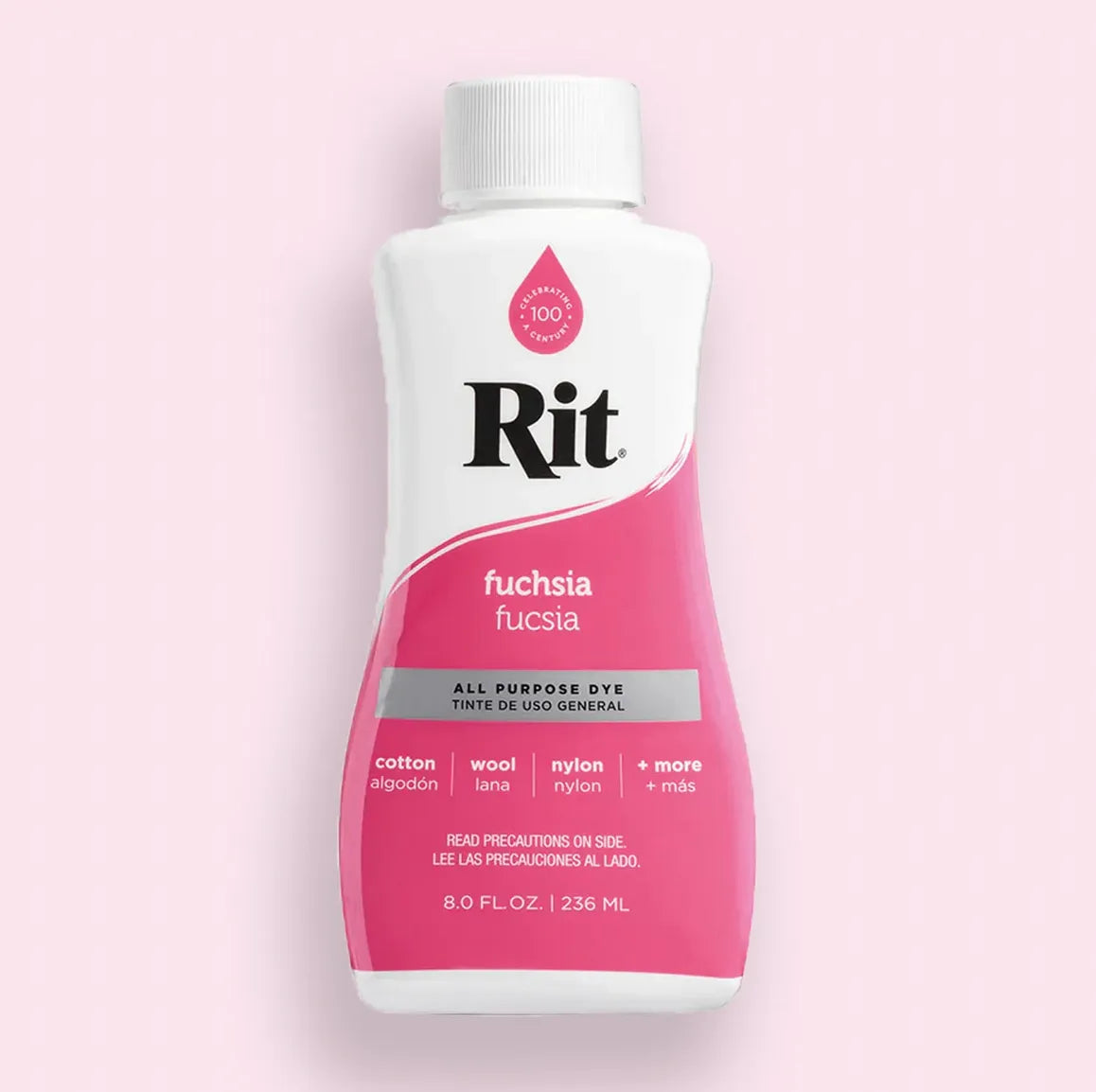 Bottle of Rit fuchsia all-purpose dye on a pink background