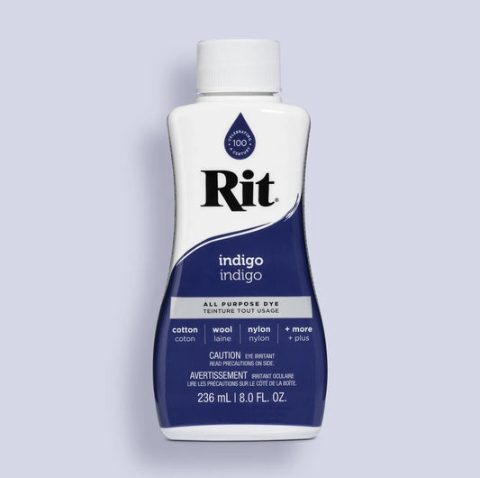 Bottle of Rit indigo all-purpose dye on a light gray background