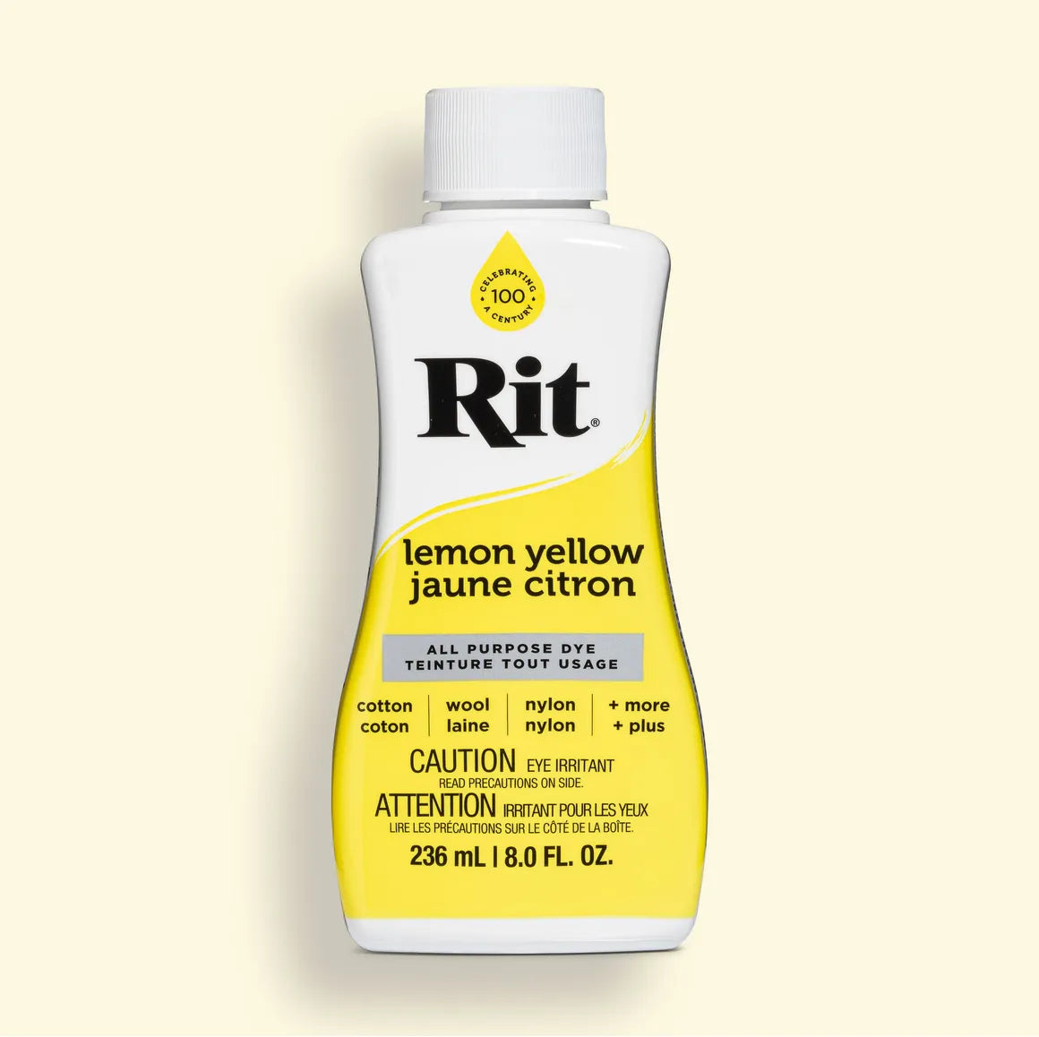 Bottle of Rit all purpose lemon yellow dye on a light yellow background