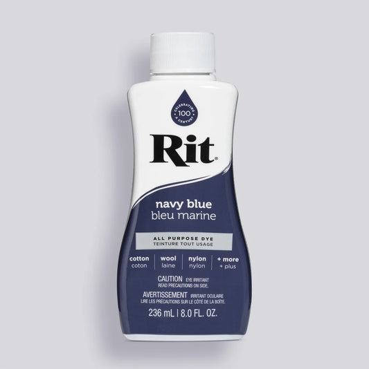 Bottle of Rit navy blue all-purpose dye on a gray background