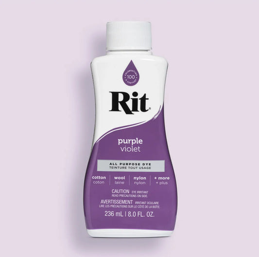 Bottle of Rit all-purpose dye in purple on a light purple background