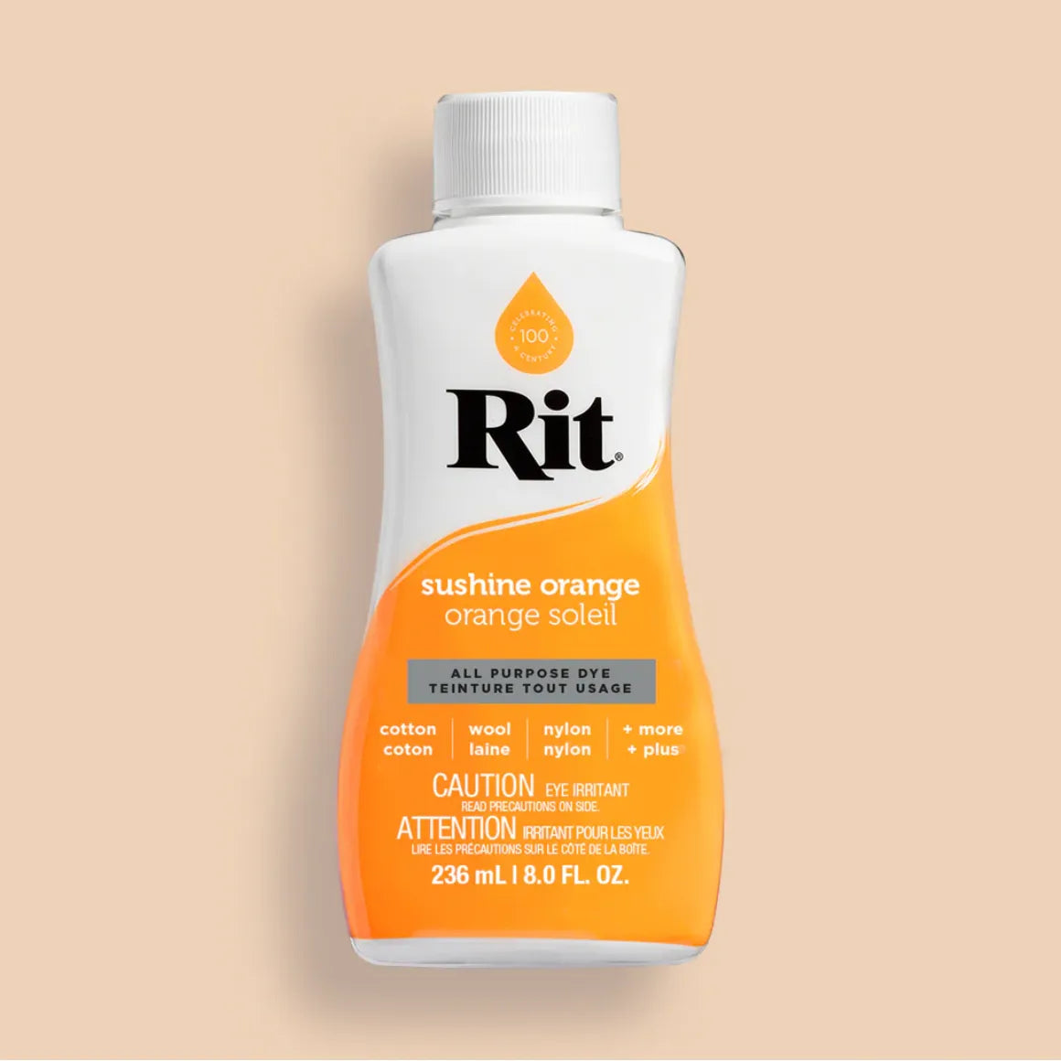 Rit dye bottle in sushine orange on a beige background