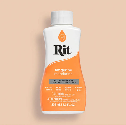 Rit dye bottle with tangerine color on a beige background