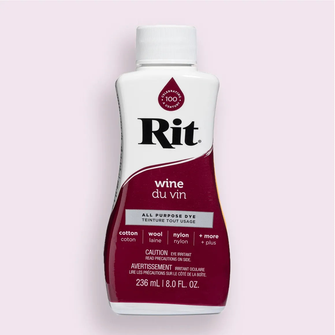 Bottle of Rit wine all-purpose dye on a light pink background