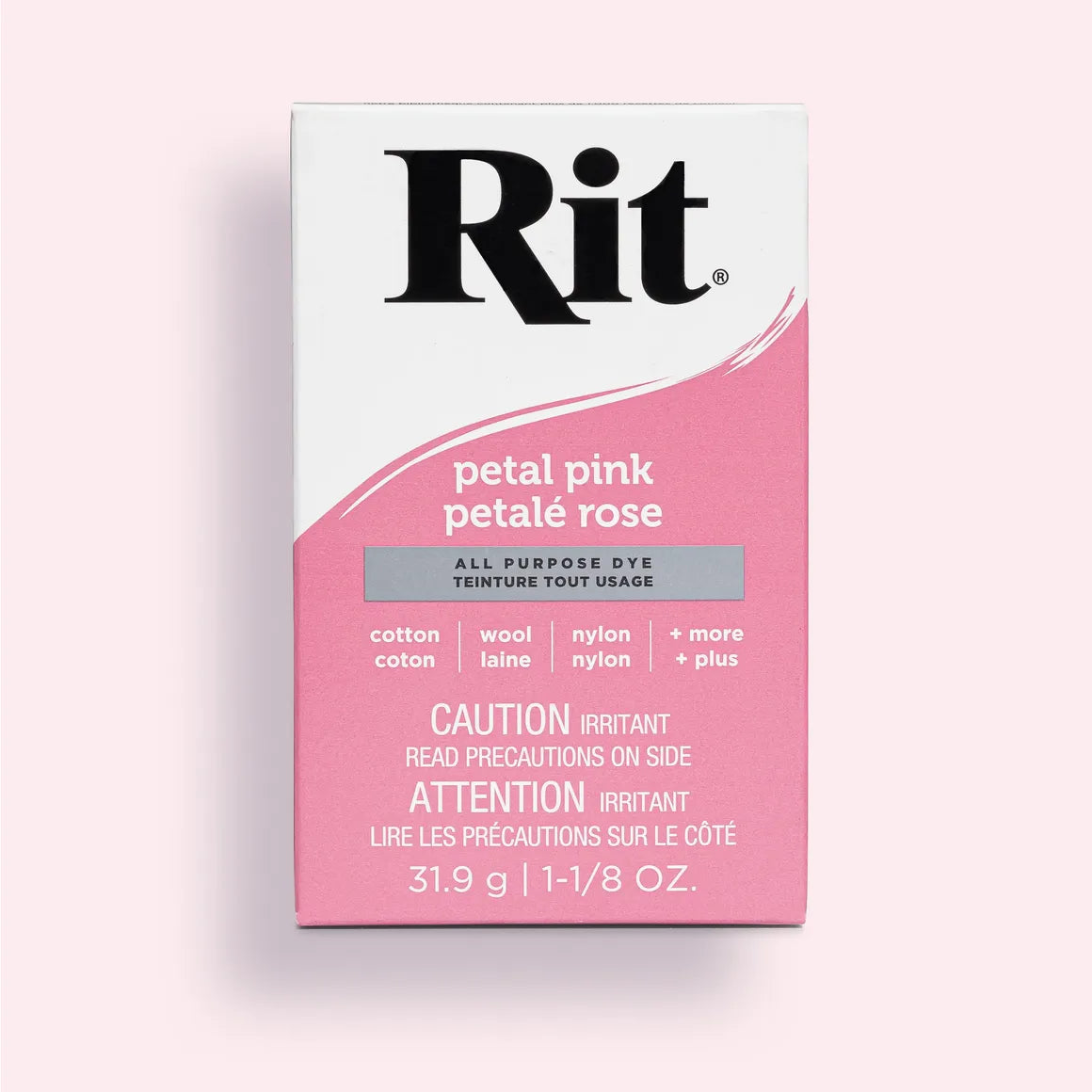 Rit dye packet for petal pink color on a light pink background