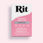 Rit dye packet for petal pink color on a light pink background