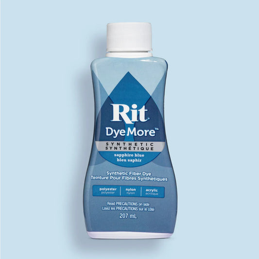 Bottle of Sapphire Blue Rit DyeMore synthetic fiber dye on a light blue background